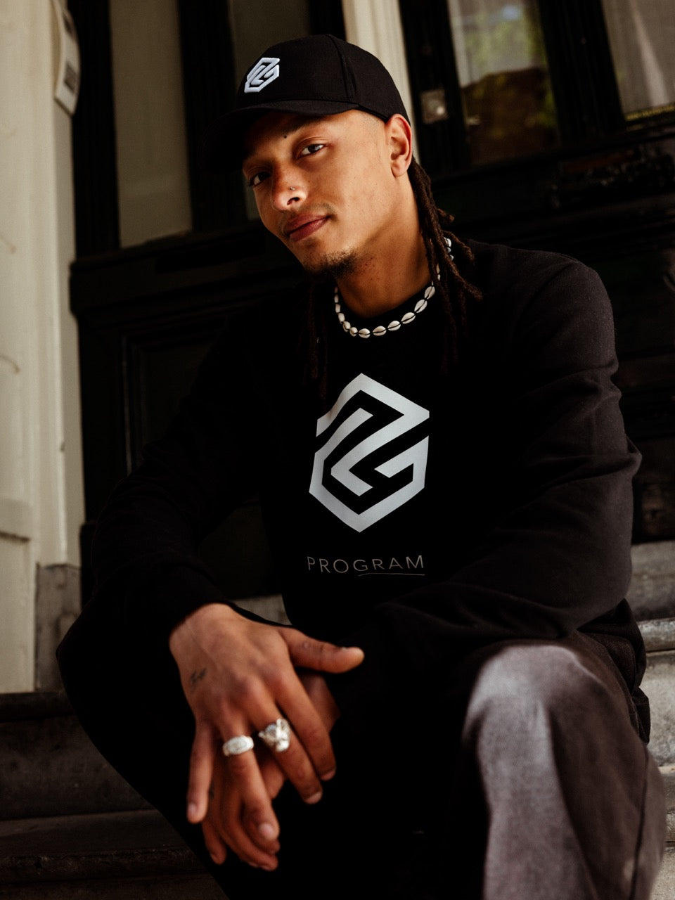 model wearing black crewneck sweater