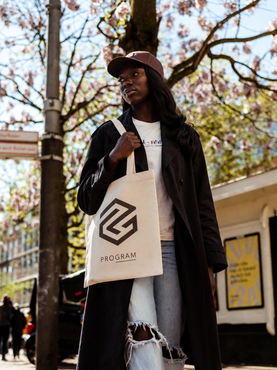 girl wearing program tote bag with logo