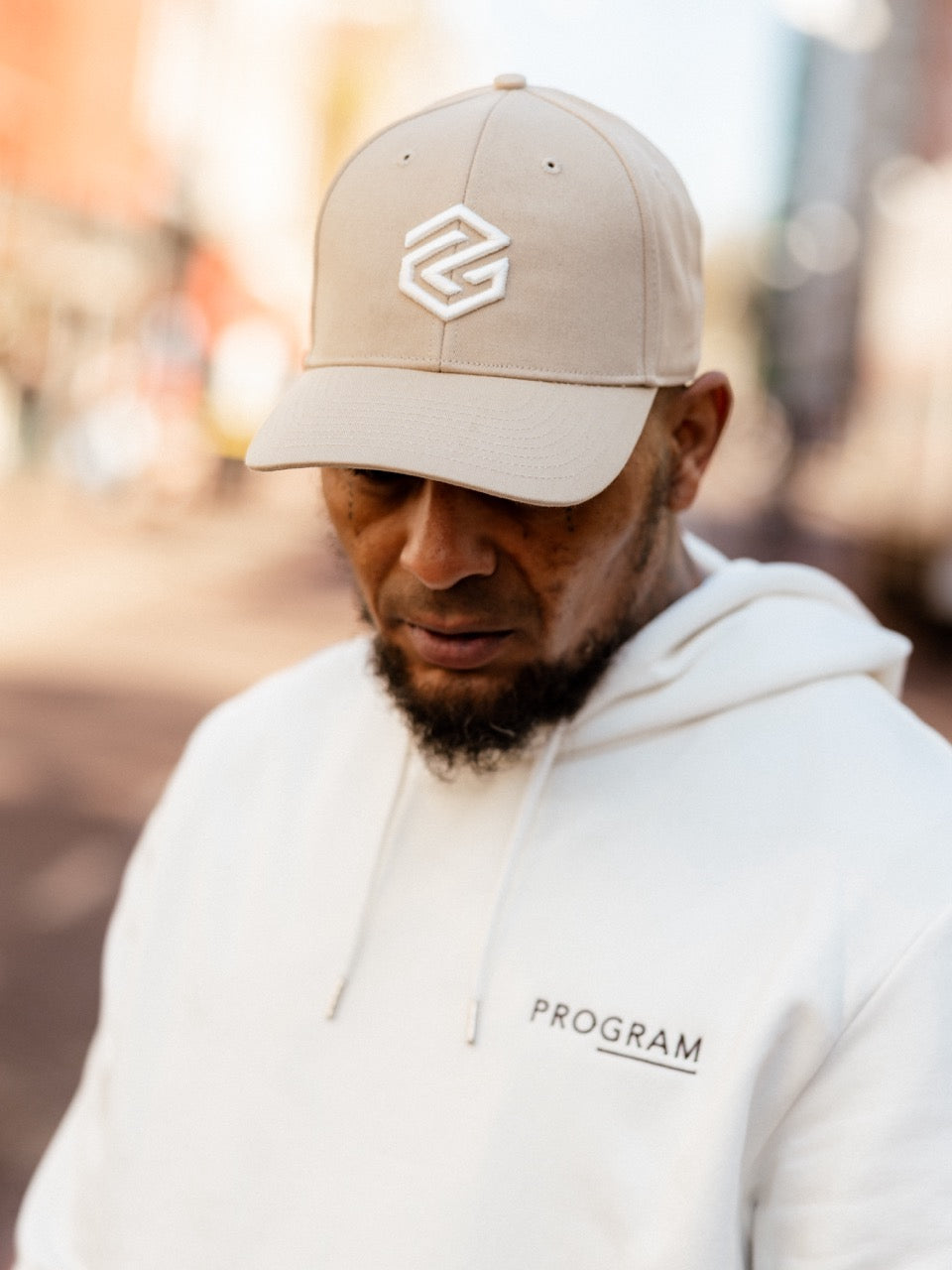 rapper sepa wearing beige program cap
