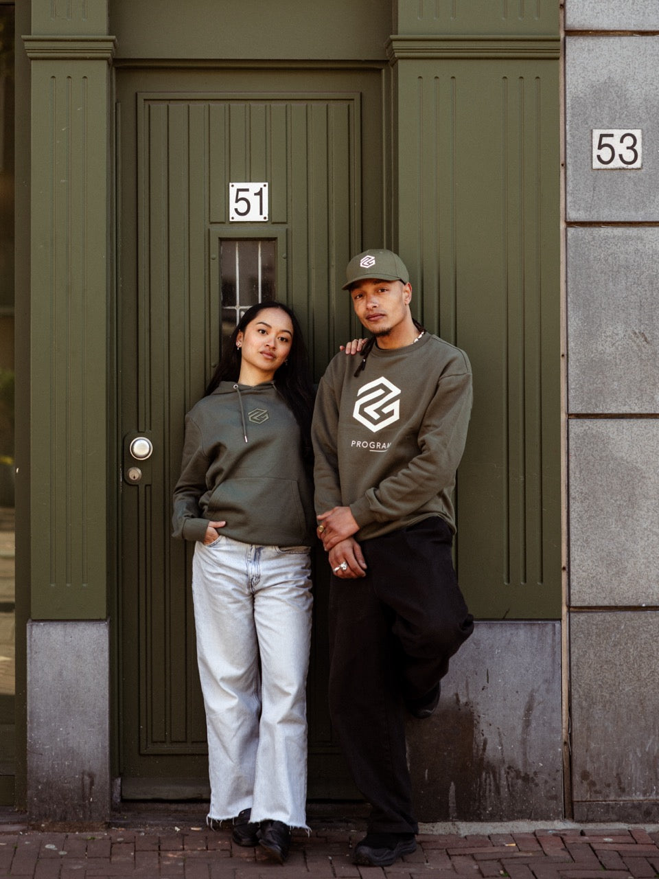 girl and boy wearing green program clothing