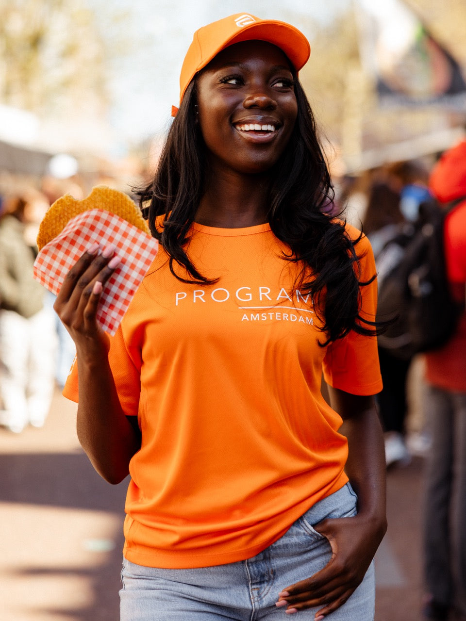 Girl wearing orange program shirt stroopwafel